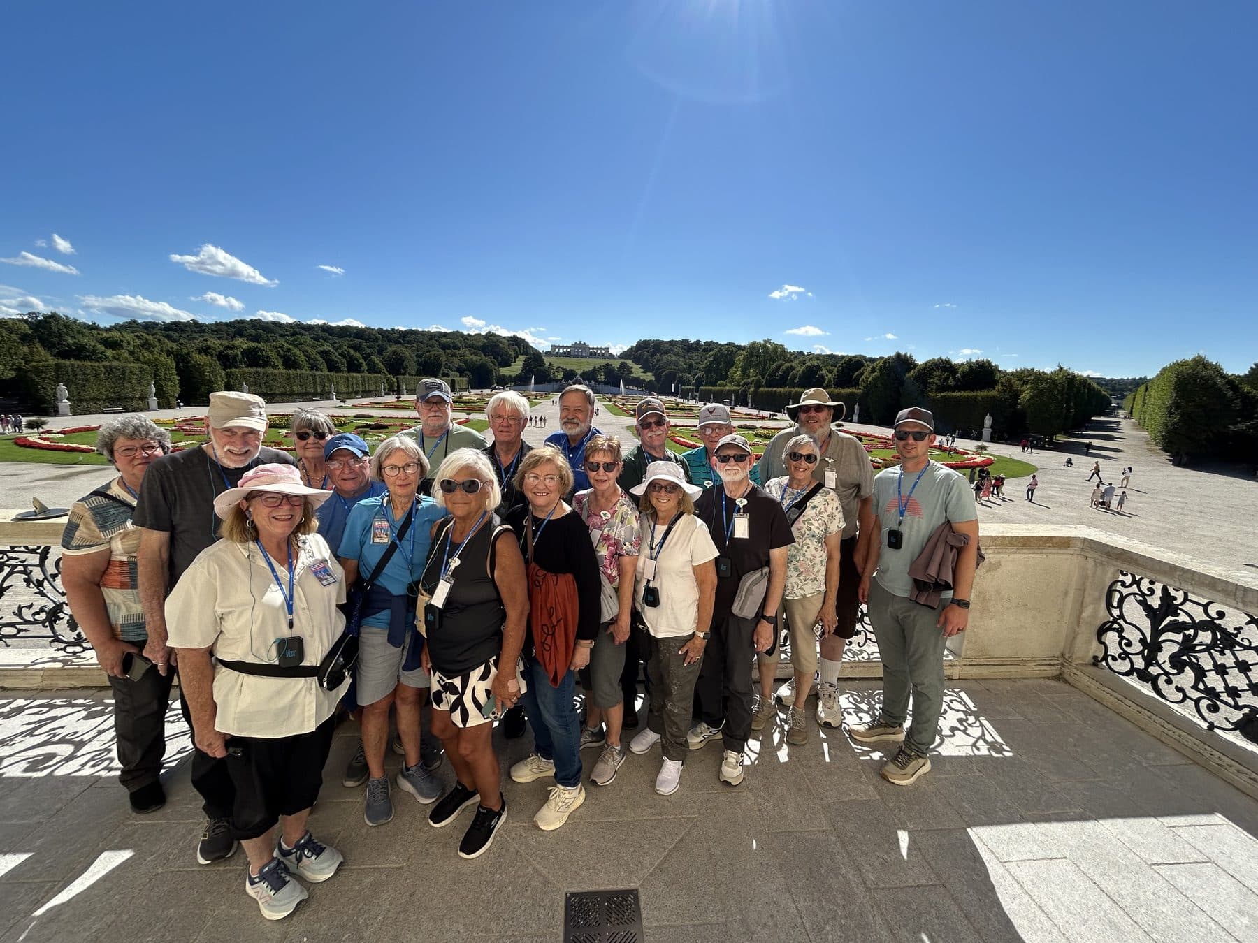 A large Tom's Christian Tours group standing together in the sunshine on tour