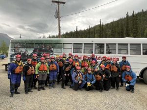 Rafters standing in front of bus