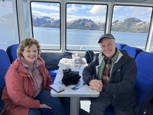 Couple sitting at table on boat