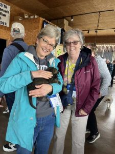 People holding puppy