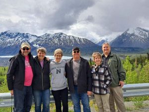 People standing with mountains in background