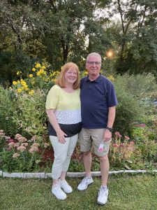 Couple standing by garden