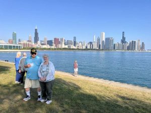 People standing on lake shore in Chicago